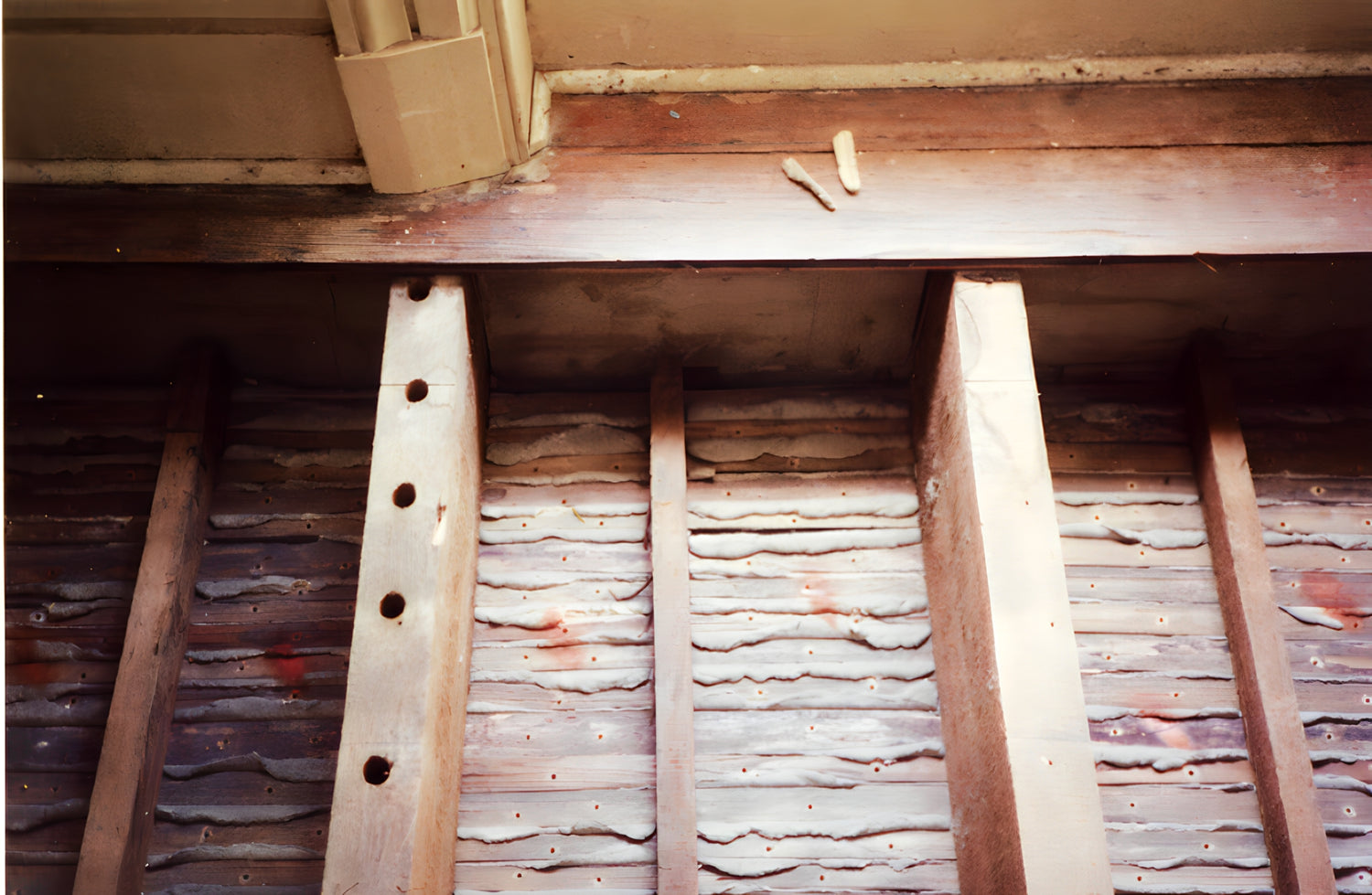 Wooden beams and planks in a storage or construction setting