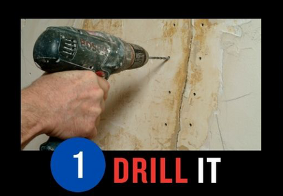 Hand holding a drill against a wall with drill bit, demonstrating the step '1 DRILL IT' in a DIY project.