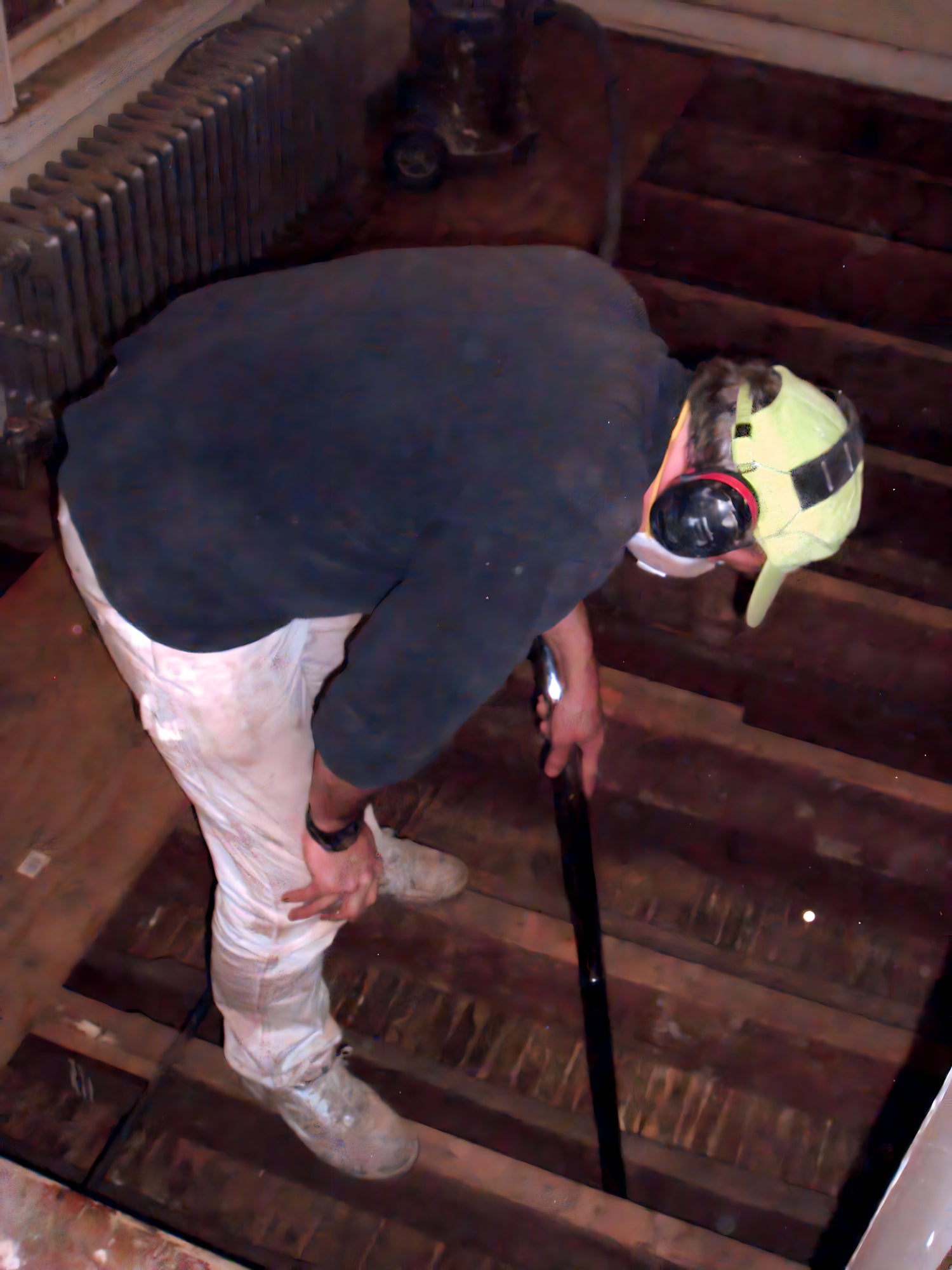 Person with protective gear climbing wooden stairs