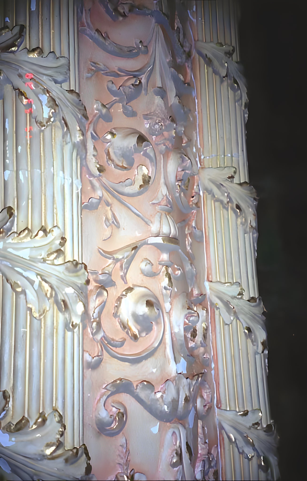 Decorative ceiling design with intricate patterns on a dark background