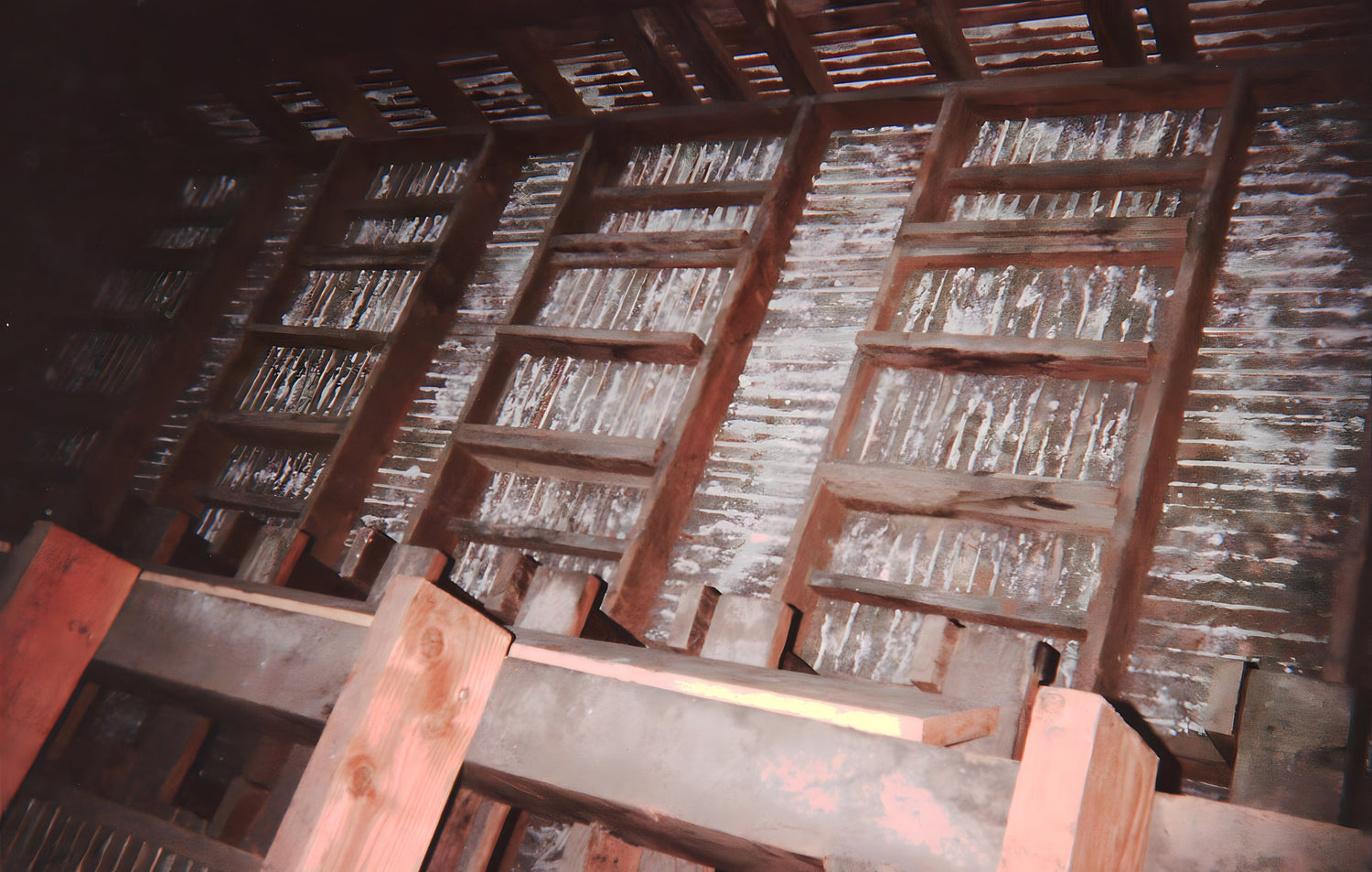 Wooden lattice structure with a focus on the intricate details of the wooden beams.
