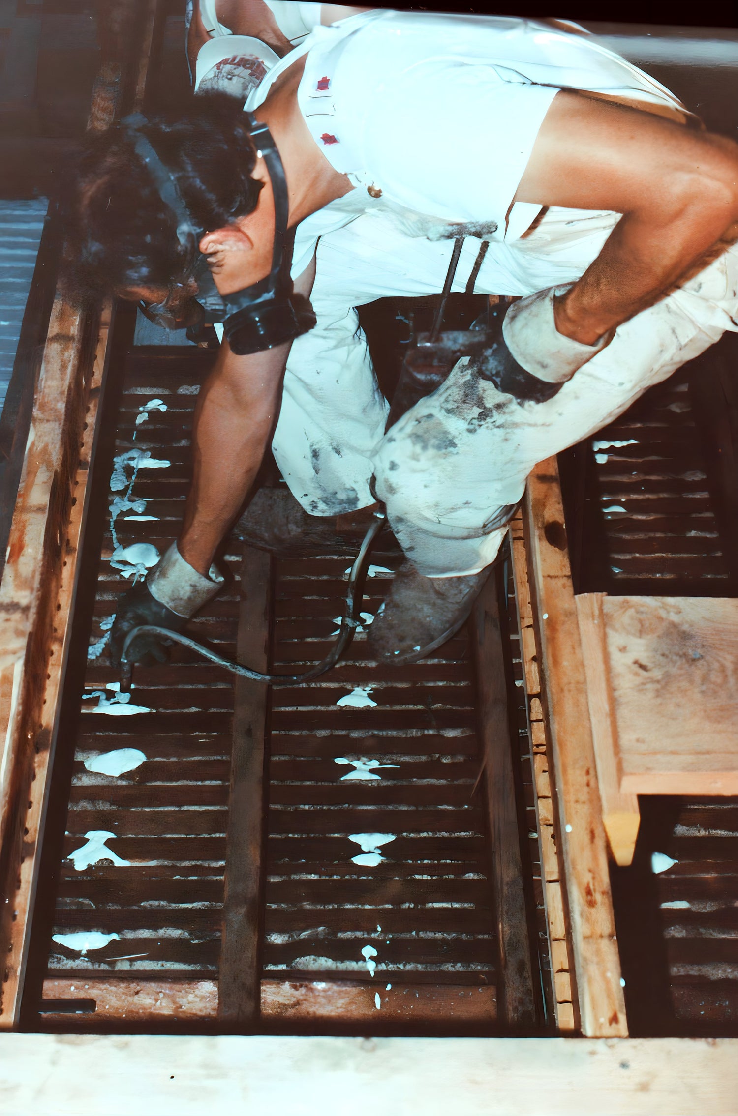Person working on a roof with protective gear