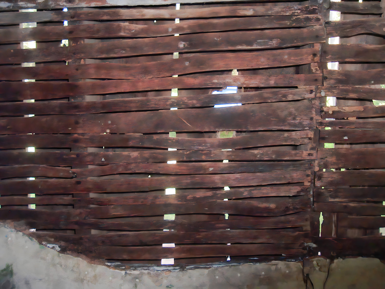 Stack of wooden planks with visible grain and texture.