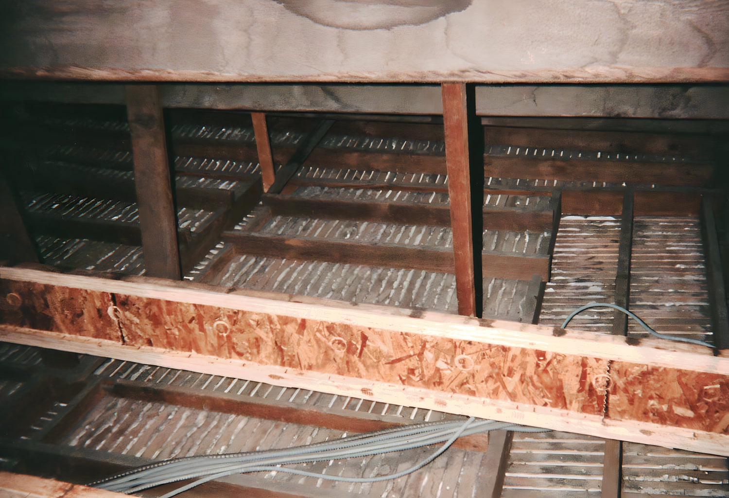 Ceiling with wooden beams and insulation material